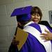 Sixth grade guidance counselor Brenda Averett embraces a graduate before the Ypsilanti High School Commencement at the Convocation Center on Tuesday, June 4. "It's almost too much for me," Averett says. She has known the students for six years. Daniel Brenner I AnnArbor.com